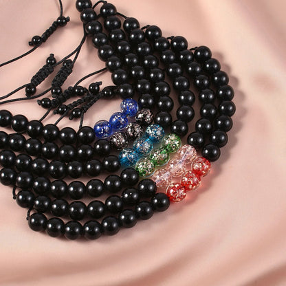 Adjustable bracelet with luminous geometric glass beads in six colour options on a wrist