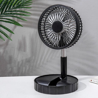 Black telescopic portable folding fan shown extended to full height on a desk, with control panel visible.