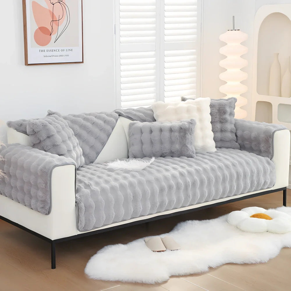 Square flannelette sofa cushion in light blue colour measuring 110x160cm on grey fabric sofa