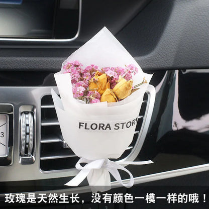 Mini dried flower bouquet mounted in car air vent for decorative aromatherapy