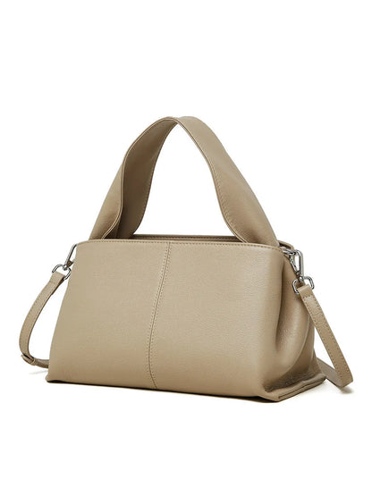 Women's genuine cowhide retro texture messenger bag in horizontal square shape, shown in apricot colour with double shoulder straps.