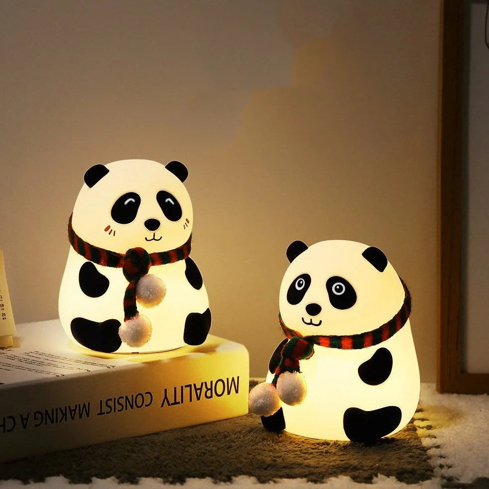 Panda-shaped silicone night light with soft white illumination, USB charging port visible
