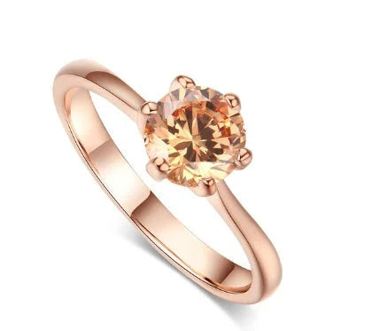 Exquisite rose gold and zircon cocktail ring with intricate geometric design and sparkling zircon gemstones