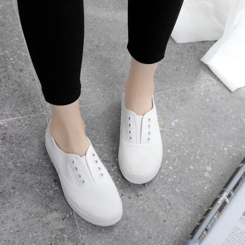 Low-top canvas casual shoes in various colours on a flat sole.