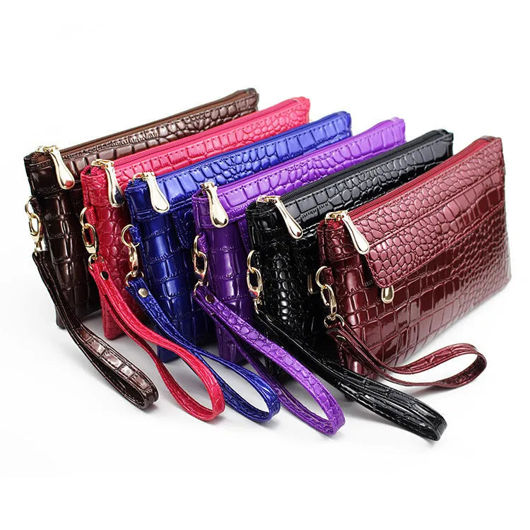 Women's black PU messenger bag showing horizontal square shape and shoulder strap