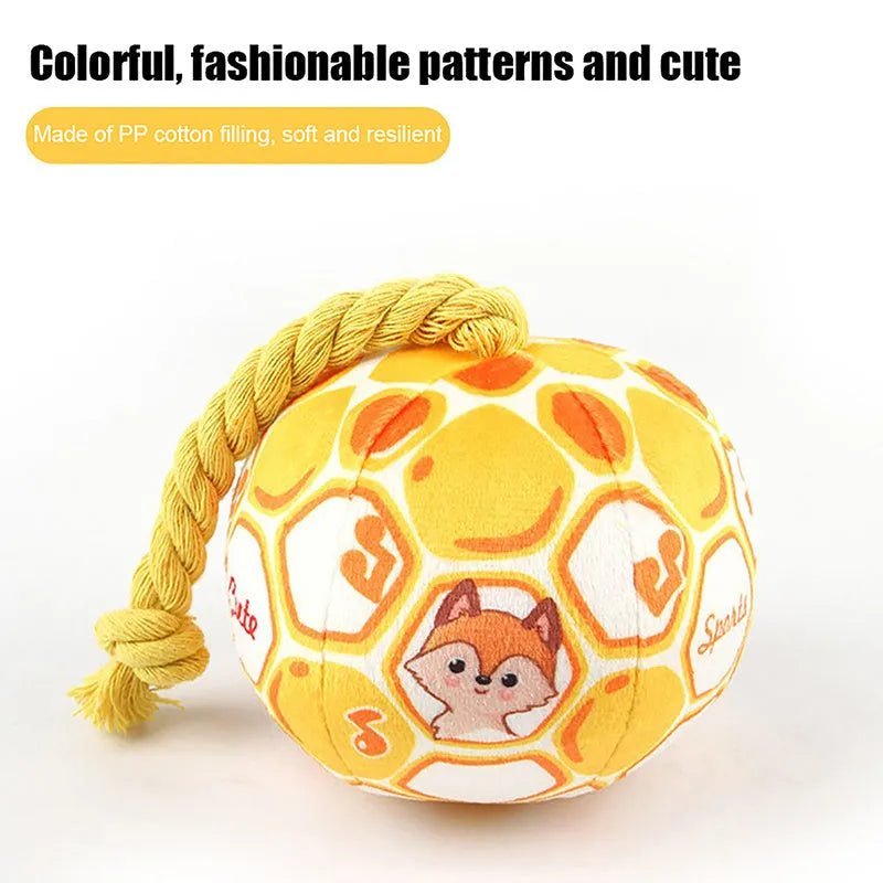 Blue and yellow elastic football dog toy with an attached cotton rope for tug of war and chewing.