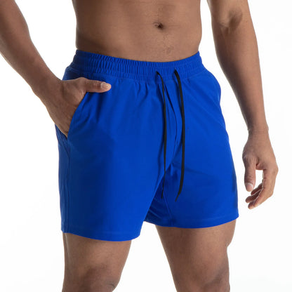 Man wearing black quick-dry polyester sports shorts suitable for running or gym workouts.