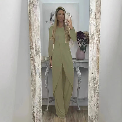 Casual black polyester two-piece lounge set with long sleeves and loose fit trousers on a hanger.