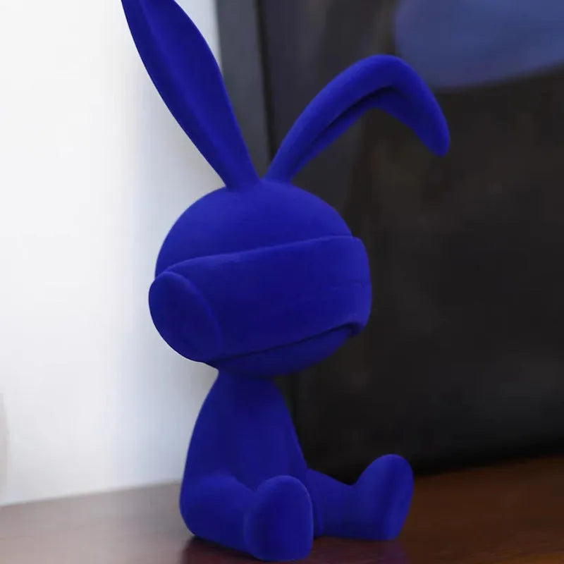 Green suede blindfold rabbit resin table ornament on a wooden shelf, showing detailed texture and 12cm height