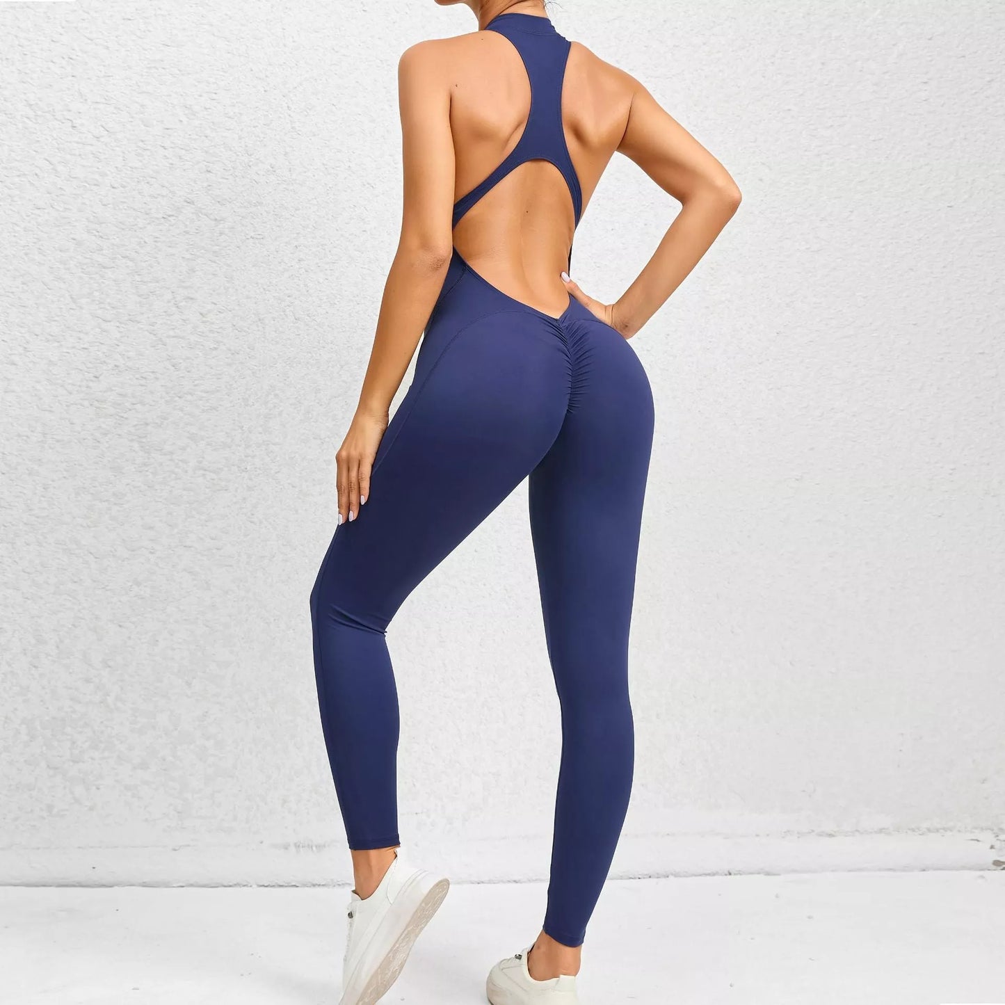 Sleeveless zippered yoga jumpsuit in navy blue with tummy control and butt lifting features