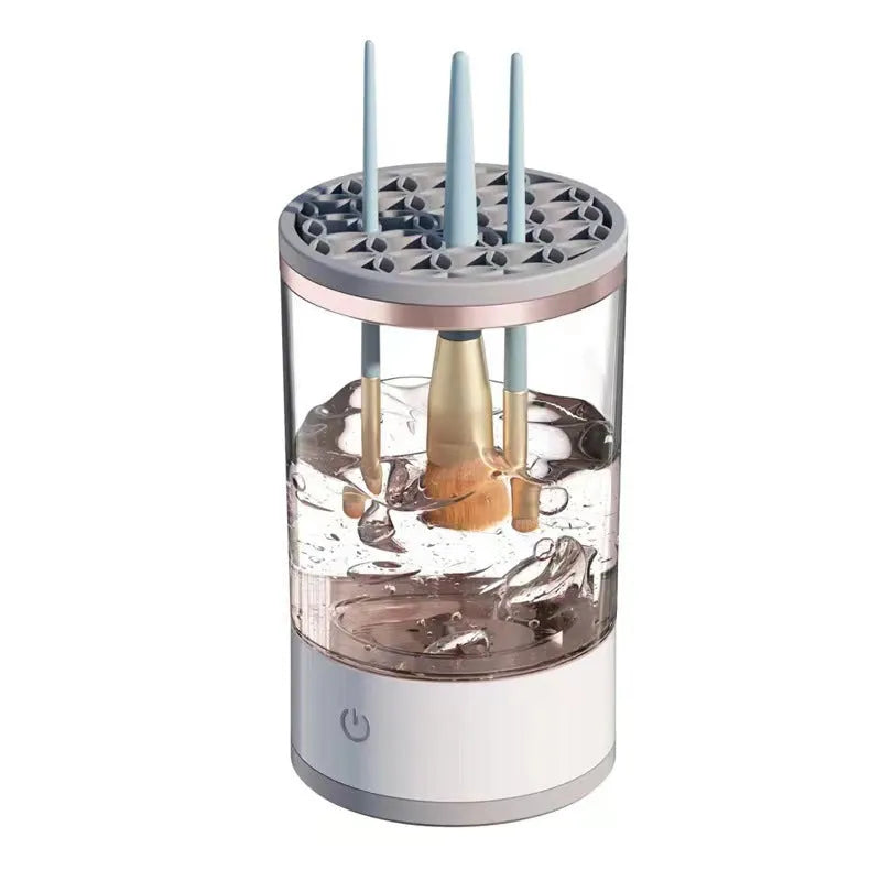 Grey and white portable electric makeup brush cleaner with USB charging cable.