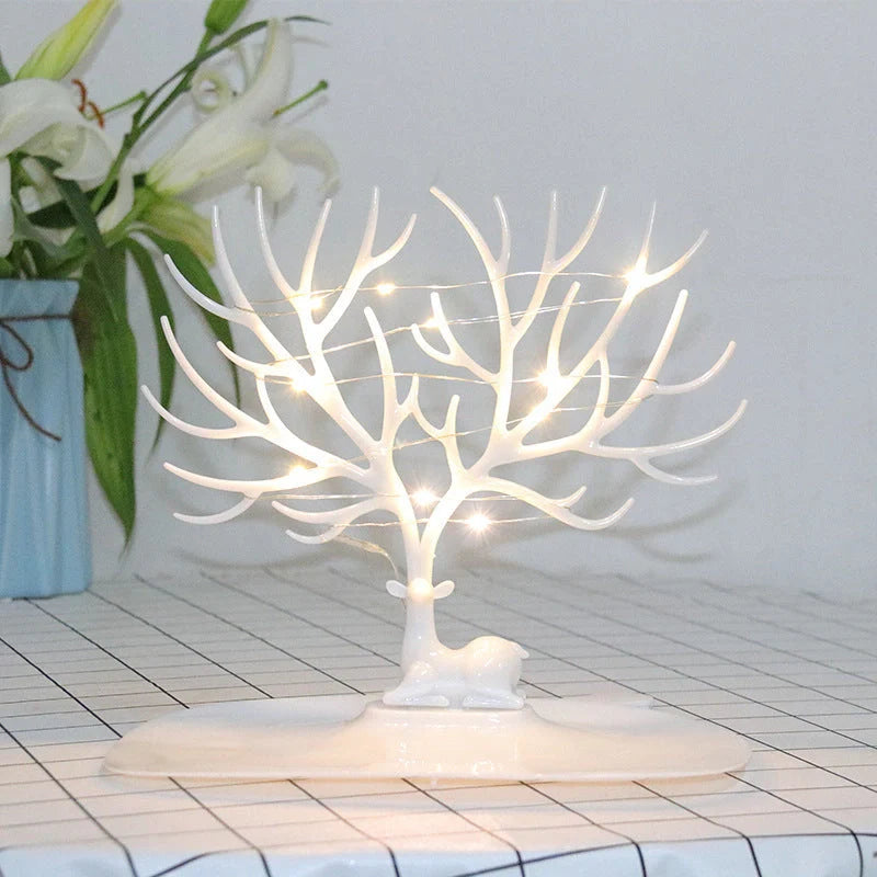 Deer Antler Jewelry Stand in white and black, organizing earrings, necklaces, and bracelets