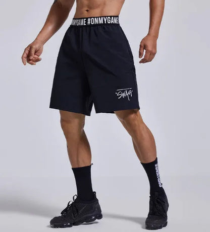 Men's loose grey sports shorts with elastic waistband and letter detail, shown front and back.