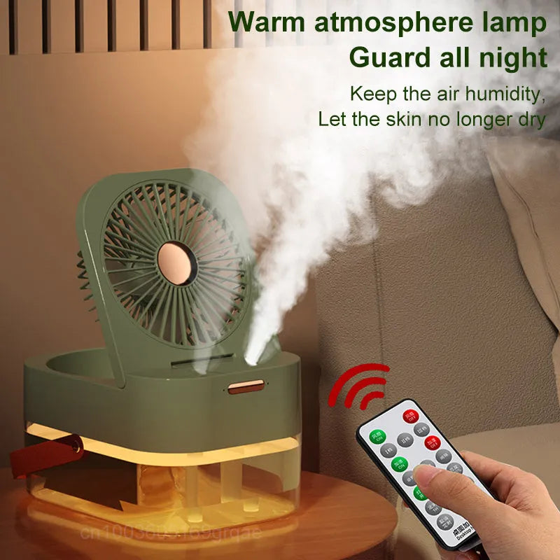 White or green USB desktop mist fan with large water tank, remote control, and dual spray nozzles on a desk.