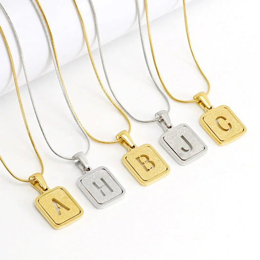 Alphabet necklace with hollow-out square design in 18K finish, personalized with any letter A-Z