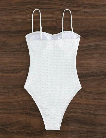 White women's one-piece swimsuit with sling design and solid colour pattern