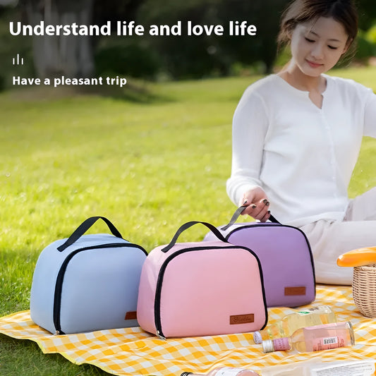Insulated lunch box bag in sapphire blue textured cloth, shown with a lunch box inside.