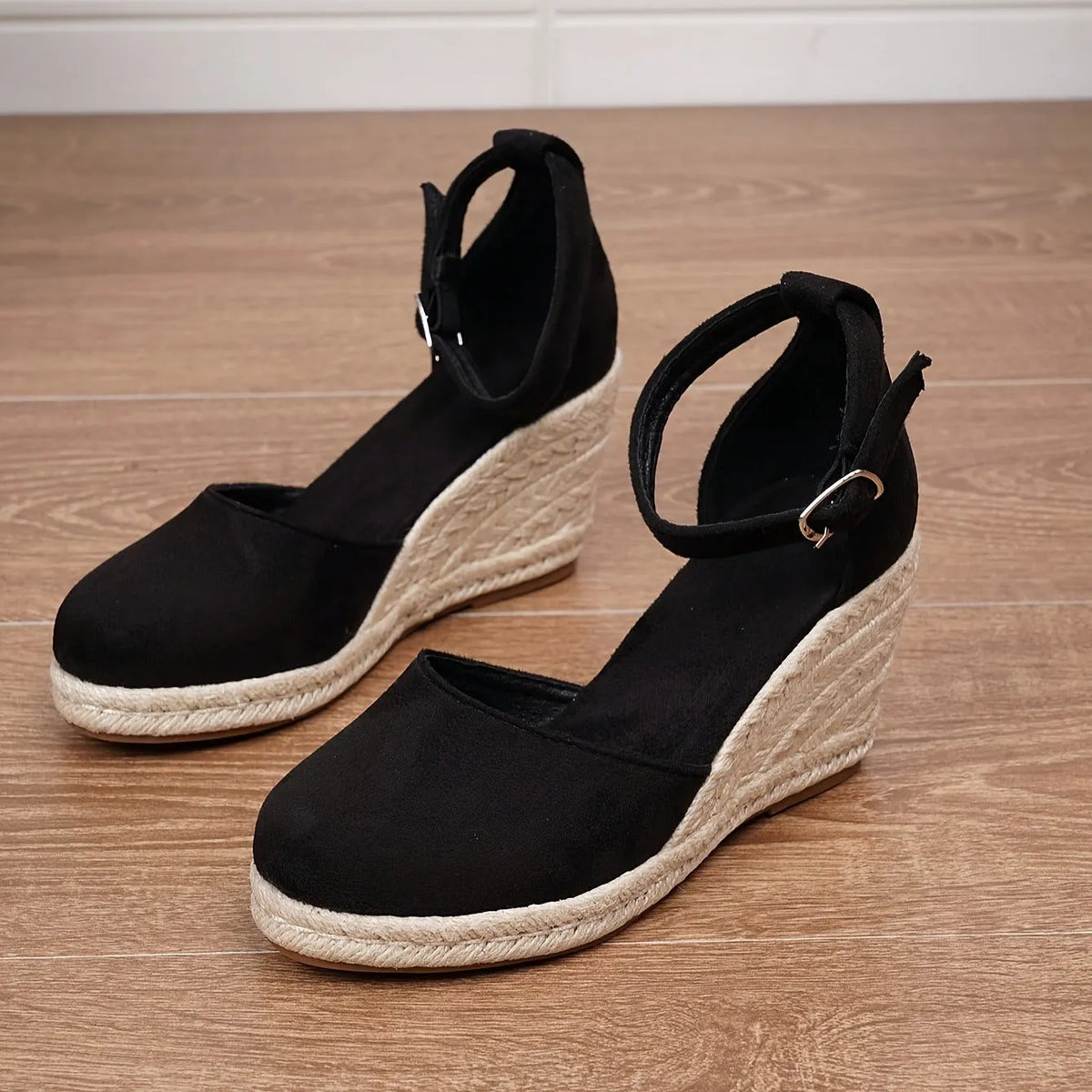 Women's apricot suede Roman style wedge sandals with adjustable buckle on a white background.