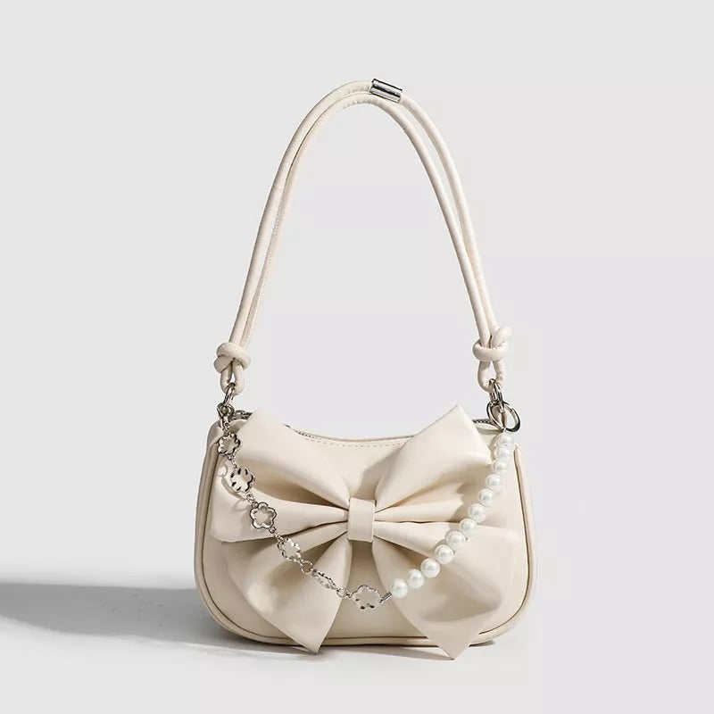 Black and white PU bow handbag with pearl chain, perfect for autumn winter fashion