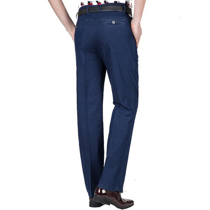 Men's high waist loose fit blue jeans on a hanger showing zip fly and casual style.