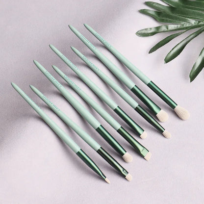 Green 13-piece makeup brush set with fibre wool bristles, metal aluminium ferrules and solid wood handles