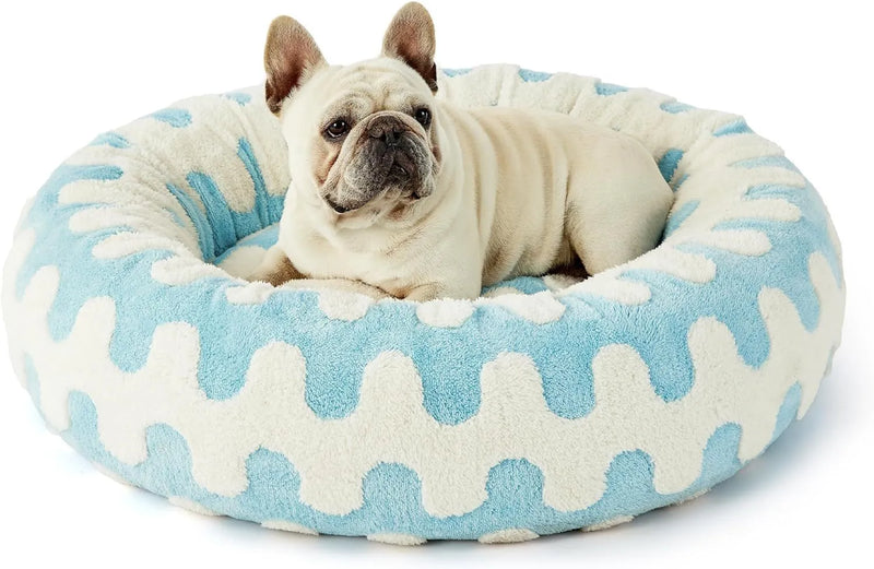Round pet bed with four seasons universal warm design in plastic construction with washable plaid fleece covers available in five colour patterns and four sizes from 50cm to 90cm diameter for dogs