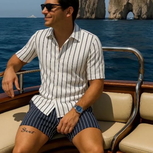 Men's blue beach shirt and shorts set with four-sided elastic fabric on beach background