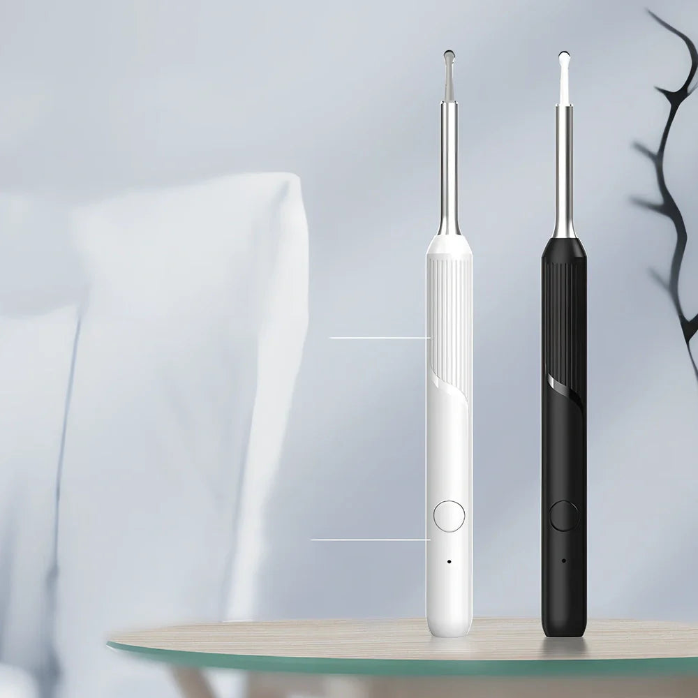 Visual ear cleaning device with camera, ear scoop attachments, and charging cable on white background