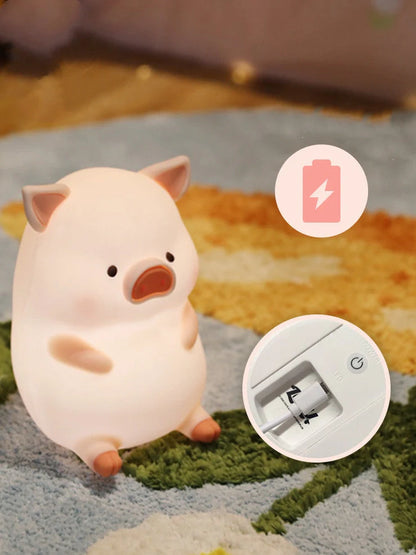 Pink silicone pig night light with USB charging cable, dimensions 180x145x130mm