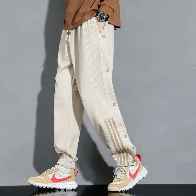 Men's loose fit ankle-tied sweatpants in a cotton blend fabric on a neutral background