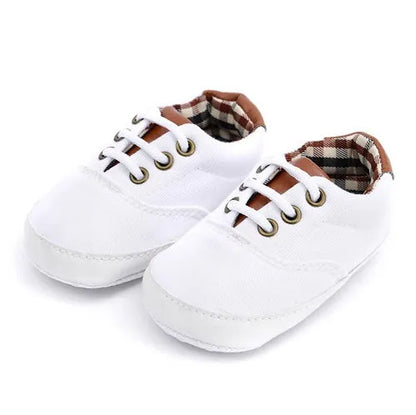 Baby canvas shoes in solid colour with soft bottom and front strap, sizes 11cm to 13cm