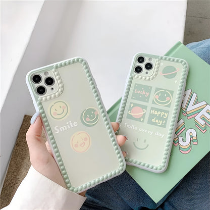 Green TPU iPhone case with geometric smiley face and polka dot frame design on a smartphone