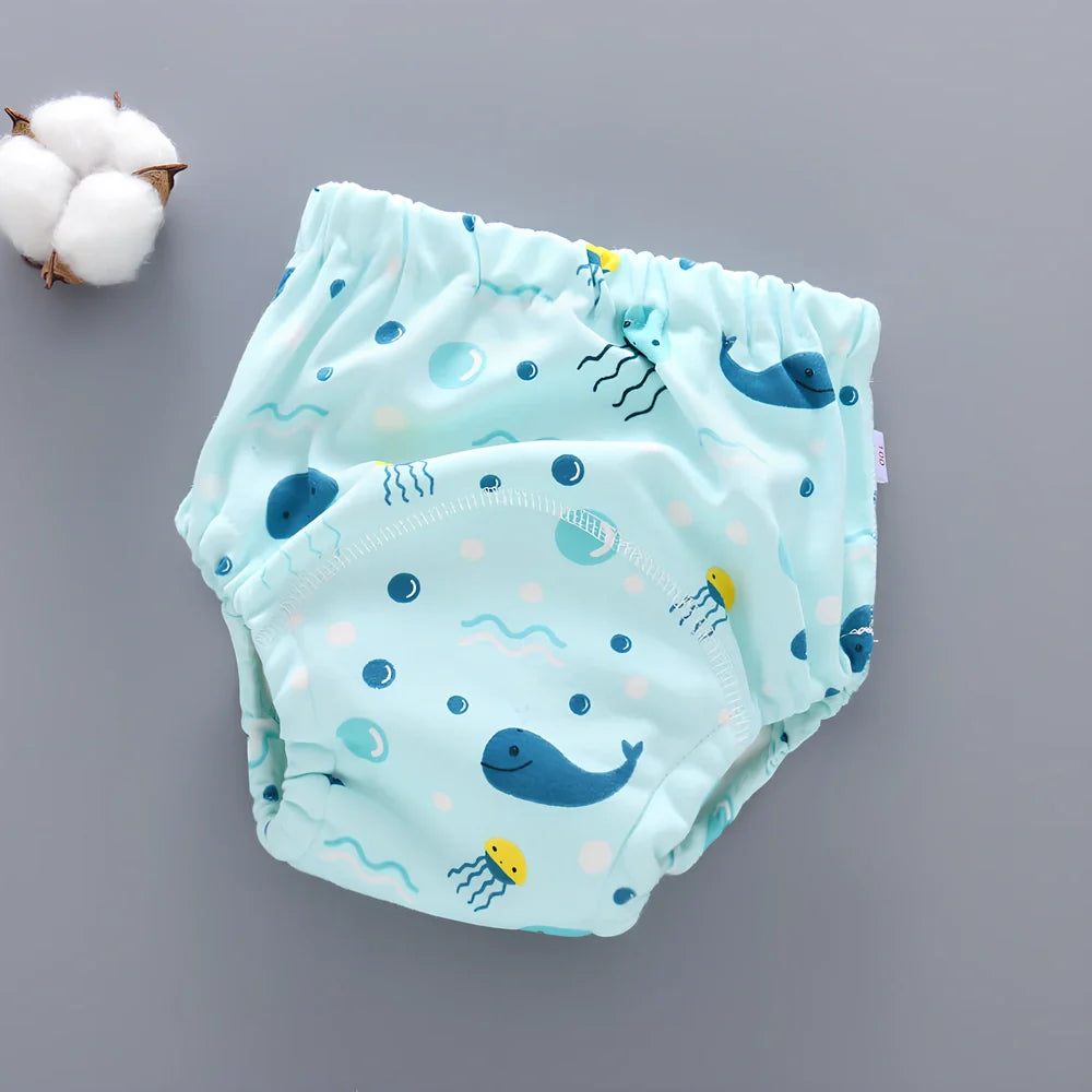 Washable baby training pants with 6-layer gauze construction in assorted patterns including animals and geometric designs