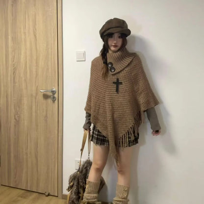 Women's triangle shawl cape in cashmere blend fabric with tassel details, shown draped over shoulders