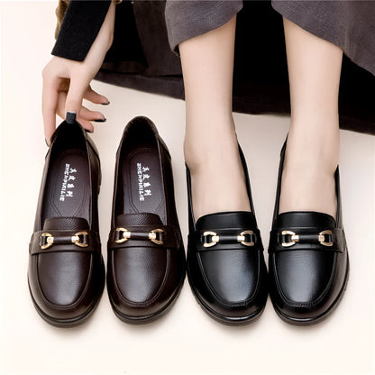 Black women's casual leather pumps with a round toe, low flat heel, and soft rubber sole.