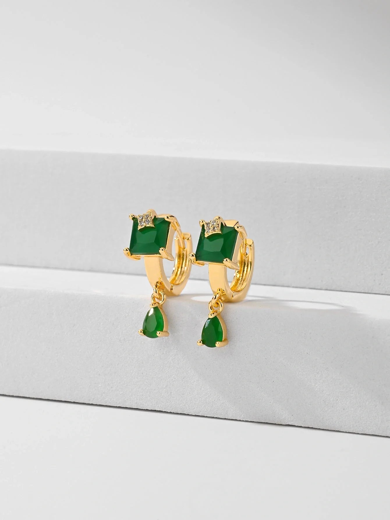 Trendy copper-plated gold fashion earrings with water droplet design in multiple colors.