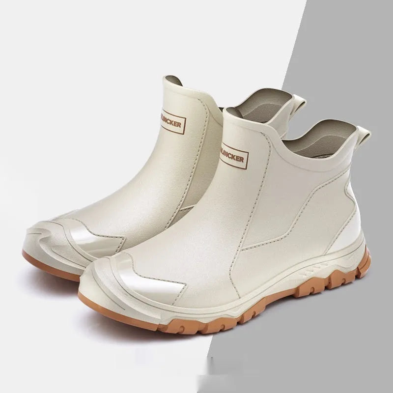 Low-cut solid colour PVC rain boot with round toe and plastic sole.