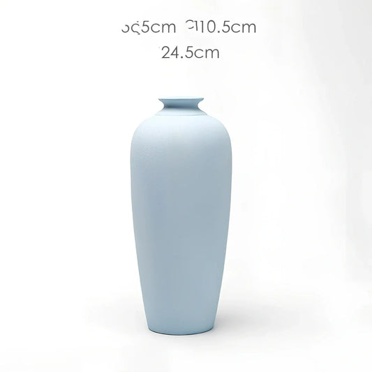 Handcrafted ceramic vase with glazed surface for dried flower arrangements in modern design