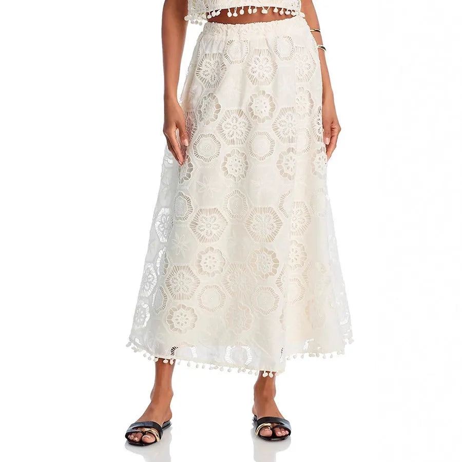 White women's sleeveless top and embroidered long skirt suit with retro art styling