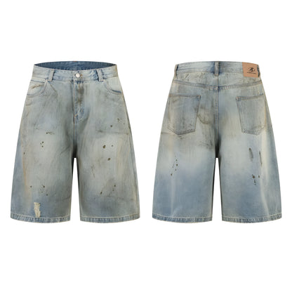 Blue denim cropped middle pants with straight-leg style and zipper fly closure on a street fashion background