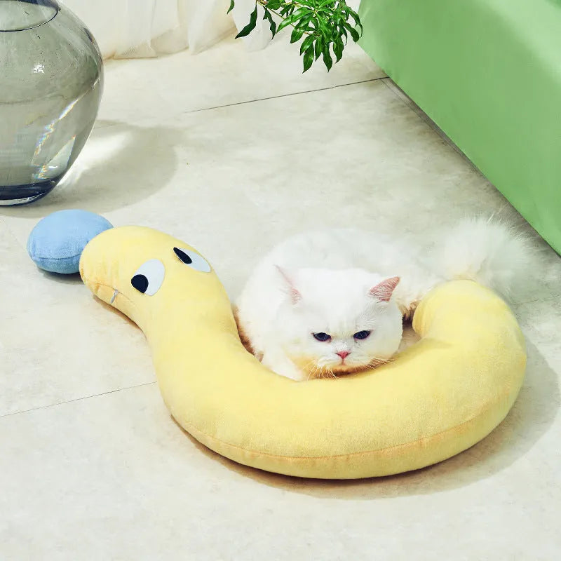 Blue rectangular pet bed cushion pad on a wooden floor.