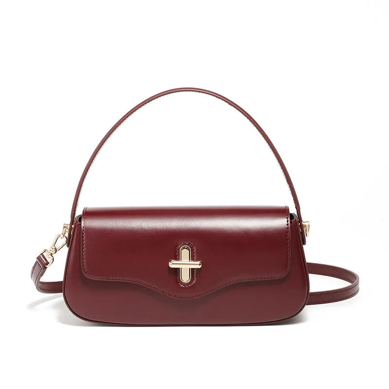 Genuine leather baguette handbag in clamshell design with internal organiser compartments