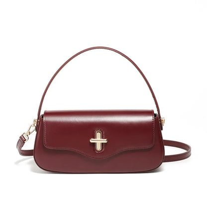 Genuine leather baguette handbag in clamshell design with internal organiser compartments