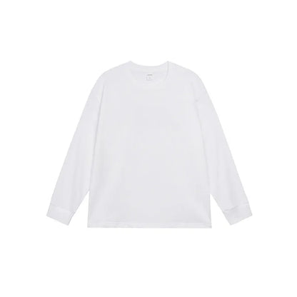 Man wearing a simple solid colour long sleeve cotton t-shirt in a loose, casual fit.