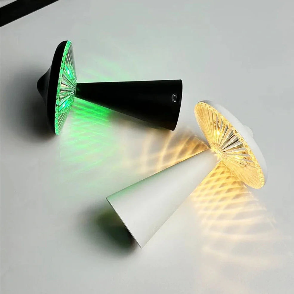 Black or white UFO-shaped night light with USB charging port and LED illumination