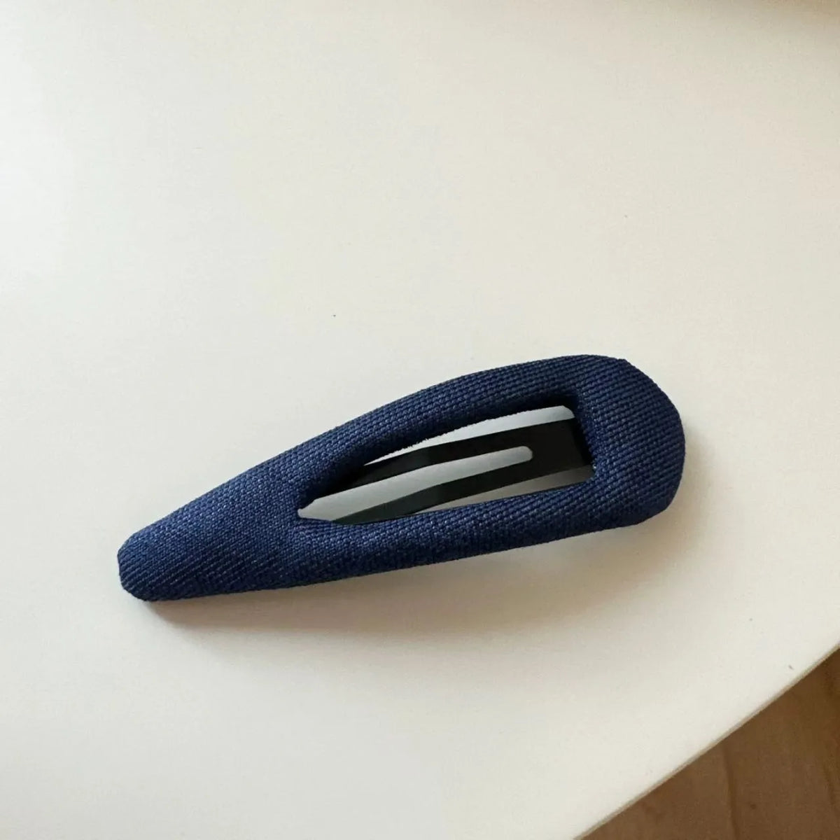 French retro dot pattern barrettes in triangle and water drop shapes with dark denim styling