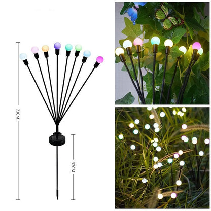 Solar-powered ground plug lawn light with automatic dusk-to-dawn operation and multiple head configurations
