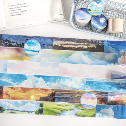 Roll of Japanese paper sky theme washi tape showing colourful clouds design, 30mm width