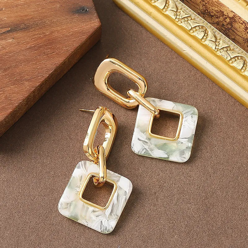 Hollow geometric square earrings with chamfered corners and electroplated copper finish