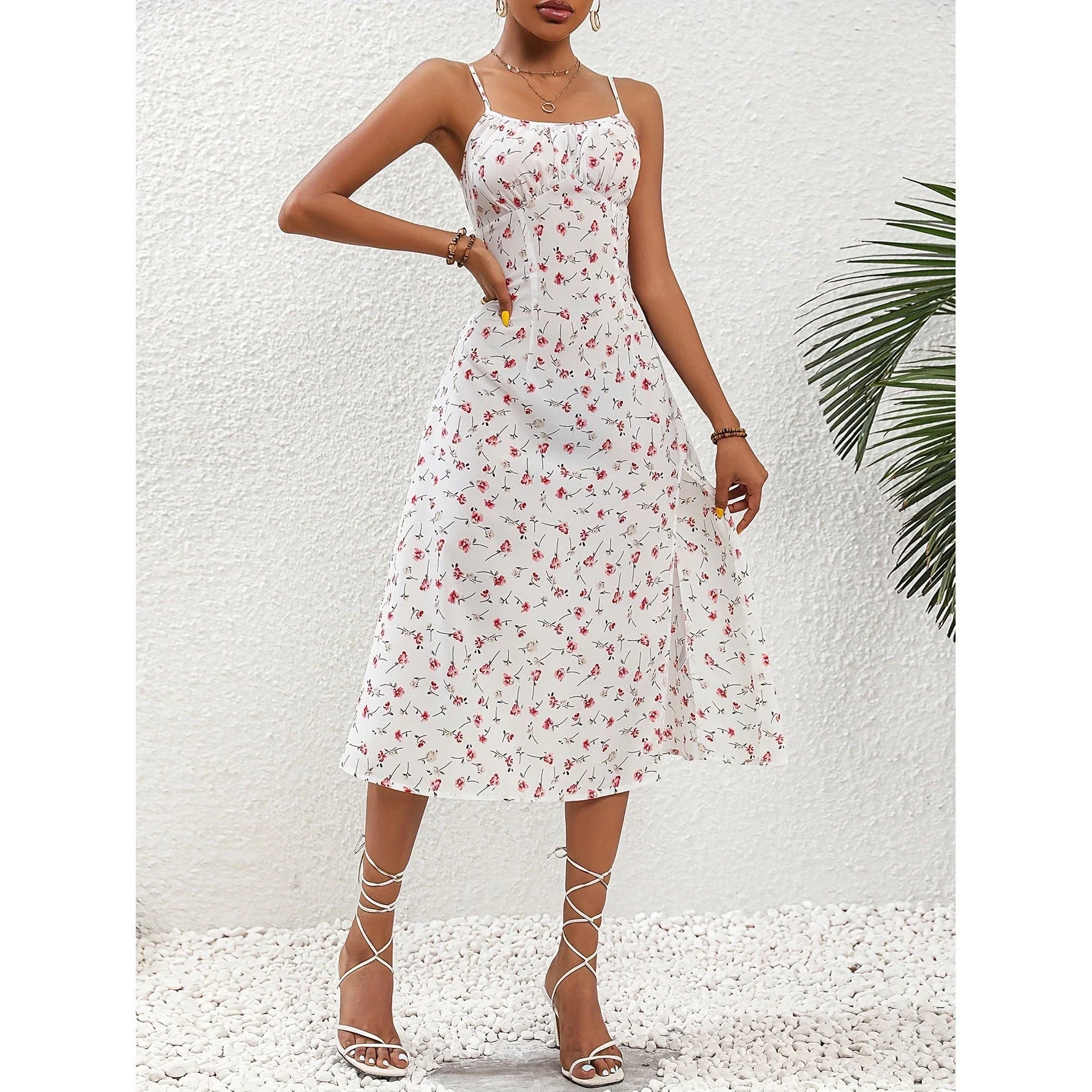 Stylish polka dot suspender dress with adjustable straps, side slit, and available in multiple vibrant colors